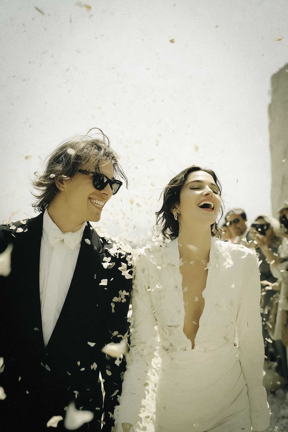 Couple exchanging vows in an Italian garden, luxury destination wedding ceremony