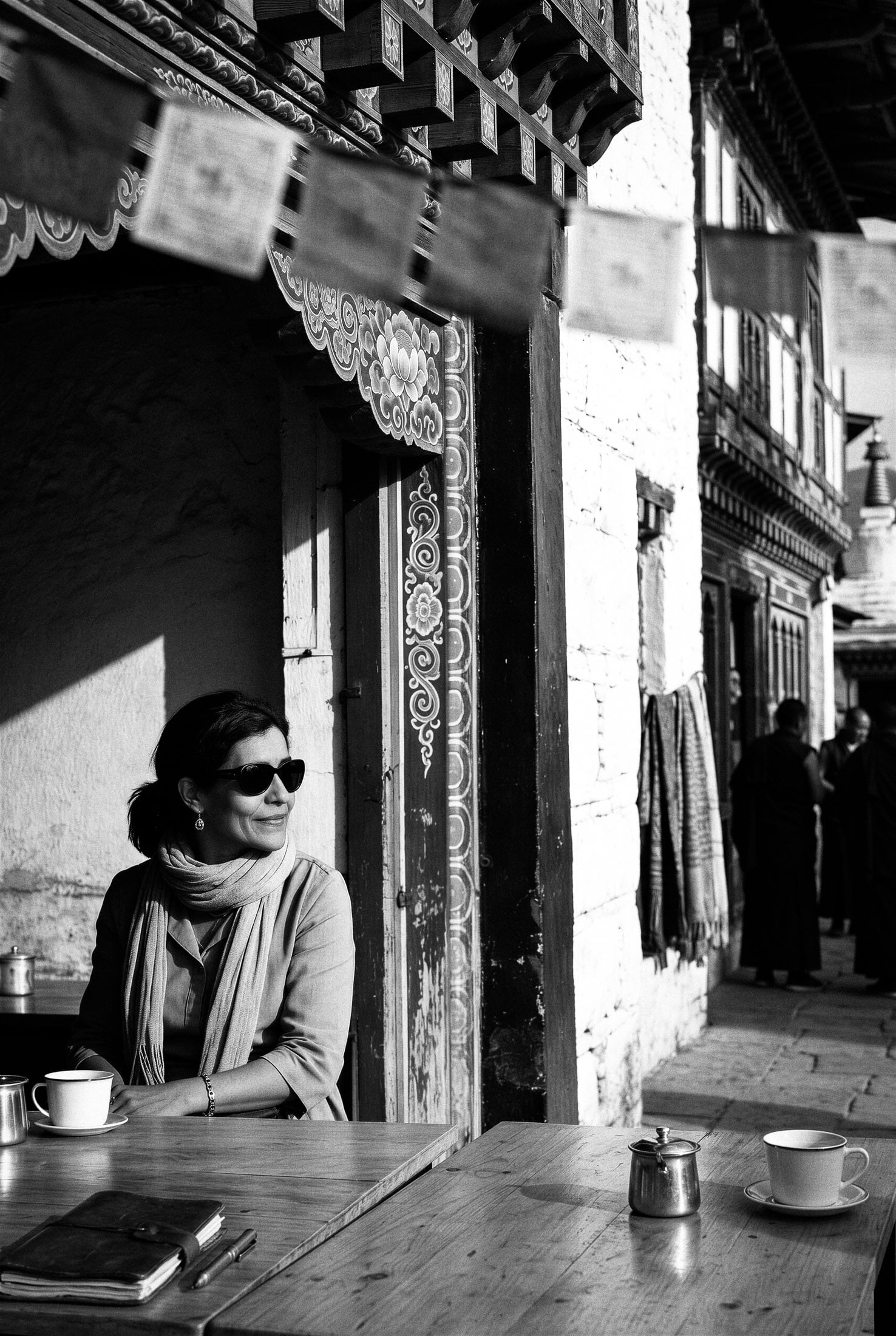 Sarah Pozzi wearing sunglasses, cultural bridge between Italy and global clientele